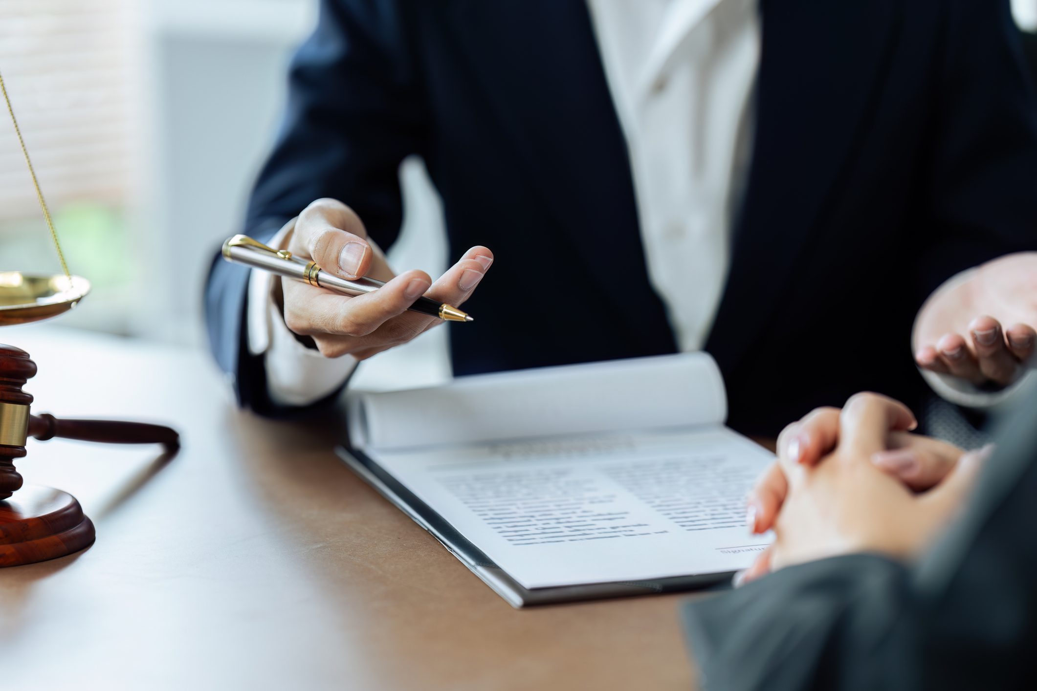Lawyer discussing documents with a client.