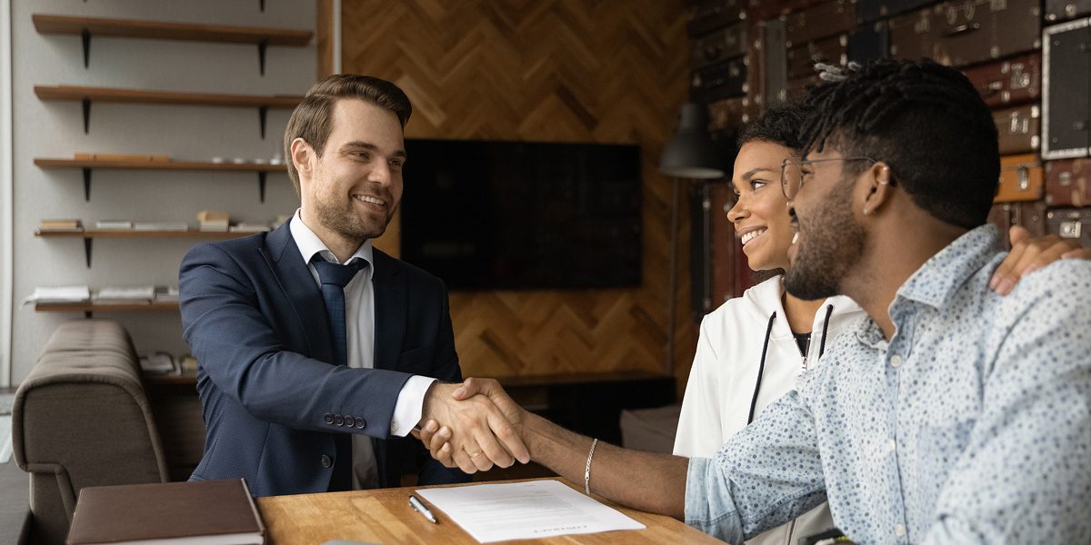 People shaking hands in a business meeting.