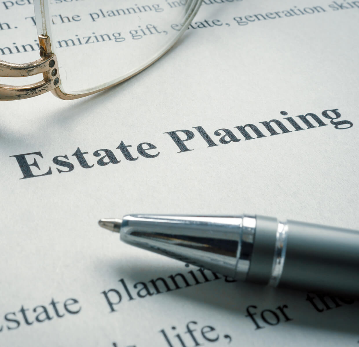 Estate planning document with pen and glasses.
