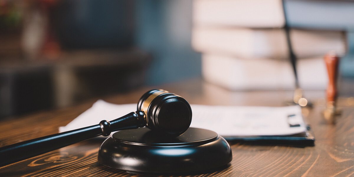 Judge's gavel on a wooden desk.