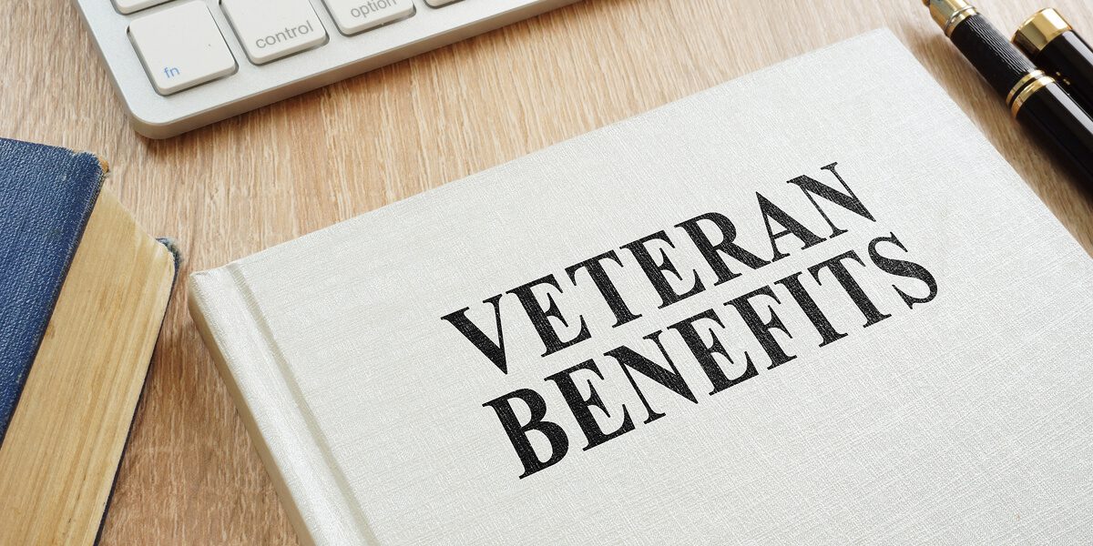 Book titled "Veteran Benefits" on a desk.